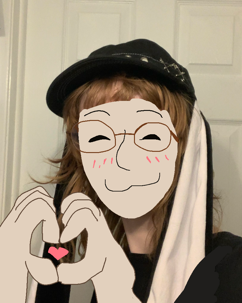 A photo of me, a white ginger teenager wearing a hot topic bunny hat and brown glasses. I have censored my face, but doodled a :3 face over it and drew in hands making a heart symbol.